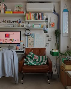 a living room filled with furniture and a flat screen tv mounted to the side of a wall