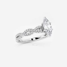 a white gold engagement ring with an oval cut diamond and pave set diamonds on the band