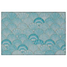 a blue wallpaper with scallop shells on it