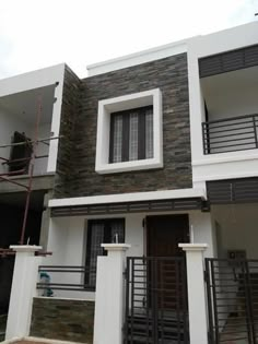 two story house with balcony and balconies