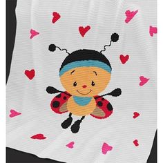 a cross stitch ladybug blanket with hearts on it