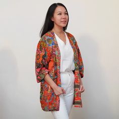 This is a washable printed batik robe/ kimono handmade by artisans, thick duster and home jacket. Because of the upcycled material and handmade nature of this item, each batik quilt kimono is not alike. The print will be of slightly different pattern and color but in variation of black, blue, pink, purple, green mix pattern. This thick quilted patchwork robe is handmade by artisans in Java using upcycled printed fabric from leftover fabric sourced from clothing manufacturer. Outer layer: 100% co