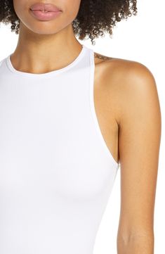 Lounge or layer in this oh-so-versatile ribbed crop top that looks (and feels) great wherever you go. 17" length (size Medium/Large) Crewneck Sleeveless Racerback 92% nylon, 8% spandex Machine wash, dry flat Imported Summer Ribbed Bodycon Tops, Ribbed Bodycon Summer Tops, Ribbed Bodycon Tops For Summer, Ribbed Bodycon Tank Top, Chic White Crop Top With Tank Straps, Ribbed Bodycon Tank Top For Summer, Summer White Ribbed Halter Top, White Ribbed Halter Top For Spring, White Ribbed Halter Top For Summer