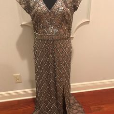 Formal Silver Beaded Gown, Platinum/Silver Beading With Nude Under Bodice. Gorgeous Sequin And Bead Work And Only Worn Once. Bottom Needs To Be Hemmed To Your Length. Fits To Size And Very Flattering. Some Sequins Are Missing But It Is Not Noticeable. Glamorous Bedazzled Formal Evening Dress, Sparkling V-neck Evening Dress For Wedding, Floor-length Sequin Dress With Rhinestones For Gala, Festive Floor-length Sequin Dress For Formal Events, Silver Embellished V-neck Evening Dress, Elegant Bedazzled Evening Dress For Wedding, Formal Beaded V-neck Evening Dress, Silver Rhinestone Gown For Prom Season, Silver Rhinestone Gown For Prom