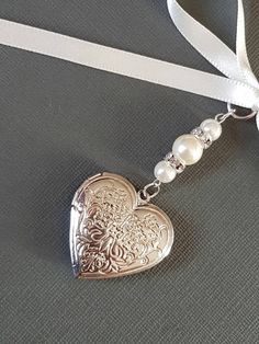 Beautiful Wedding Bouquet Charm Heart Shaped Embossed Silver - Etsy Silver Heart Charm Jewelry For Bridesmaid, Heart-shaped Wedding Charms Jewelry, Silver Wedding Jewelry With Heart Charm, Silver Heart Charm Jewelry For Wedding Gift, Silver Heart Beads Jewelry For Wedding, Bouquet With Ribbon, Bridal Bouquet Charms, Wedding Bouquet Charms, Heart Shaped Locket