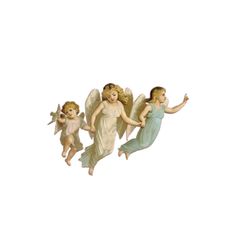 three little angel figurines flying in the air