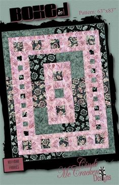 a quilted wall hanging on the side of a green and black background with pink flowers