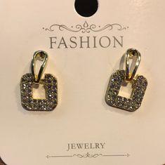 "Add some sparkle to your everyday look with these Gold and Rhinestone Square Studs. These stunning studs boast a timeless design and a touch of luxury, perfect for elevating any outfit. Made with high-quality materials, they're sure to be a valuable addition to your jewelry collection." Trendy Evening Jewelry With Rhinestones, Trendy Formal Jewelry With Rhinestones, Trendy Jeweled Crystal Jewelry, Trendy Rhinestone Jewelry For Formal Occasions, Chic Rhinestone Earrings For Gift, Trendy Crystal Earrings For Wedding, Trendy Rhinestone Earrings For Evening, Trendy Cubic Zirconia Crystal Earrings, Chic Crystal Earrings With Rhinestones