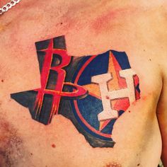 a man with a tattoo on his chest that has the letter b and h in it