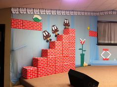 a nintendo themed room with mario and luigi's castle made out of lego blocks