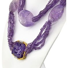 Indulge in the captivating allure of this exquisite David Webb Lavender Bead Necklace. Handcrafted with meticulous attention to detail, this necklace is a testament to the brand's impeccable craftsmanship. Each of the five strands features lustrous amethyst beads, showcasing their enchanting lavender hue.Adding to its allure are the large egg-shaped amethyst stations, creating a striking focal point. These impressive amethysts, measuring about 4.5cm in length and 10cm in diameter, exude a sense Luxury Purple Necklace With Gemstone Beads, Luxury Purple Jewelry With Round Beads, Luxury Gemstone Beads, Luxury Amethyst Gemstone Beads Jewelry, Formal Amethyst Gemstone Bead Necklace, Luxury Amethyst Necklaces With Natural Stones, Luxury Amethyst Necklace With Natural Stones, Luxury Amethyst Necklace For Formal Occasions, Luxury Purple Natural Stones Jewelry