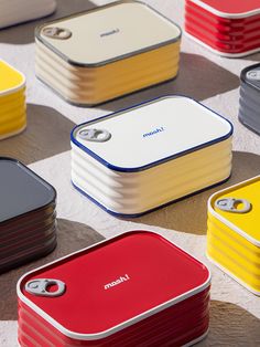 several different colored cases sitting on top of a table