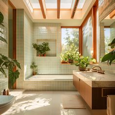 a bath room with a tub a sink and some plants on the windowsills