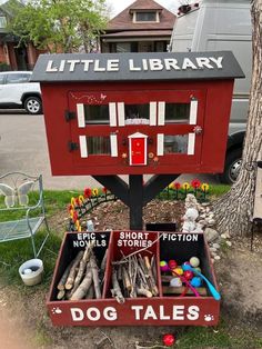 a little library with toys in it on the grass