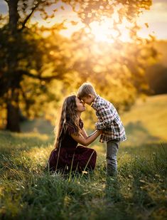 A mother and her young son touch foreheads and snuggle as the sun sets behind them. Fall Mommy And Son Pictures, Family Poses For 4, Fall Picture Poses For Family, Mother And Sons Photo Ideas, Red Truck Family Pictures, Family If 3 Photoshoot, Cute Family Poses, Family Of 3 Fall Photo Ideas