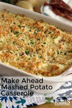 make ahead mashed potato casserole in a white dish on a colorful tablecloth