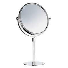 a mirror that is on top of a stand