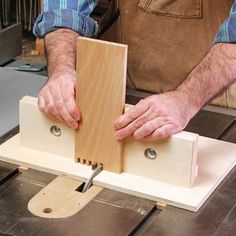 a man using a table saw to cut wood