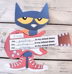 a paper cut out of a cat holding a football helmet with the words i'm ready to play in my school shoes