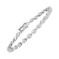 This diamond tennis bracelet features beautifully cut pear-shape diamonds set gorgeously in 18k white gold. Metal: 18k Gold Diamond Cut: Pear-Shape Natural Diamond Total Diamond Carats: 4.50cttw Diamond Clarity: VS Diamond Color: F-G Color: White Gold Bracelet Length: 7.5 inches Diamond Bracelet Design, Bracelet Tennis, Diamond Tennis Bracelet, White Gold Bracelet, Vs Diamond, Bracelet Design, Tennis Bracelet Diamond, Pear Shaped Diamond, American Diamond