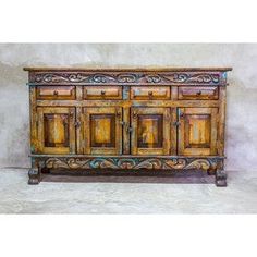 an old wooden cabinet with ornate carvings on the front and sides, against a white background