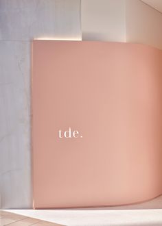 a pink wall with the word tede written on it