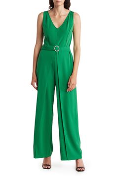 Set the trend in this sleeveless crepe jumpsuit featuring an attached belt with a sparkling buckle and elegant leg overlays. V-neck Sleeveless Unlined 96% polyester, 4% spandex Hand wash, line dry Made in the USA Model stats: 5'10" height, 32" bust, 25" waist, 36" hip. Model is wearing size Small. Elegant Green Strapless Jumpsuit, Elegant Spring Jumpsuits And Rompers With Belt Loops, Chic Belted Strapless Jumpsuit For Work, Sleeveless Belted Formal Jumpsuit, Green Sleeveless Jumpsuits For Evening, Sleeveless Belted Jumpsuit For Party, Sleeveless Belted Formal Jumpsuits And Rompers, Sleeveless Belted Jumpsuit For Formal Occasions, Sleeveless Belted Jumpsuits And Rompers For Evening