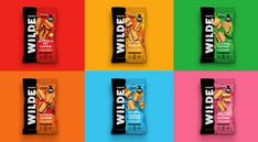 four different flavors of wild snacks on colored squares