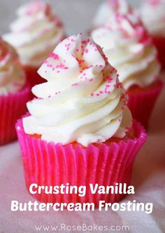 cupcakes with white frosting and pink sprinkles