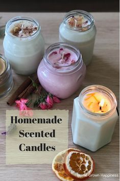 homemade scented candles are displayed on a table