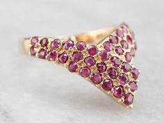 This vintage multi-stone ring creates a luxurious statement on the hand! The rubies are exquisite, a deep blood red that is the perfect complement to the highly polished gold of the setting! Metal: 14K Yellow Gold Gem: 41 Rubies Gem Measurements: 1.5 mm, Round Ring Size: 7.25 Marks: "14K" Stamped on the inside band Gold Rings Fashion, Blood Red, Round Rings, Fashion Ring, Multi Stone Ring, Multi Stone, Gold Fashion, Ring Size 7, Eternity Bands