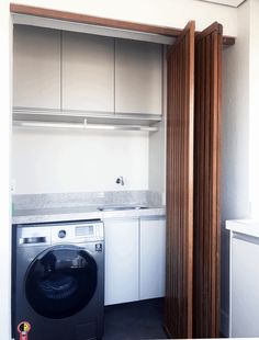 a washer and dryer in a small room