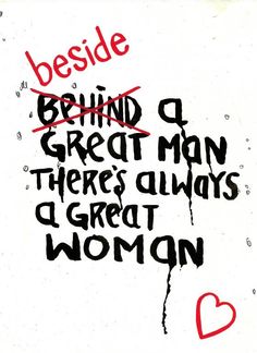 a white sign with writing on it that says, beside behind a great man there's always a great woman