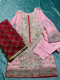 size:Medium  Heavy embroidered Stitched 3piece dress. Shirt: front heavy embroidered and embroidered on back & design on sleeves and shirt bottom. Dupatta: heavy embroidery on chiffon  bottom:straight plain pant No return or exchange please. Note:Please contact me if you have any problem with your order. Elegant Jamawar Dresses With Zari Work, Party Wear Chanderi Kurta With Resham Embroidery, Chanderi Kurta With Resham Embroidery For Party Wear, Festive Party Wear Lawn Suit With Resham Embroidery, Festive Resham Embroidery Lawn Suit For Party, Festive Resham Embroidery Lawn Suit, Chinon Lawn Suit With Intricate Embroidery For Party, Designer Party Wear Kurta With Embroidery, Party Wear Kurta With Intricate Embroidery