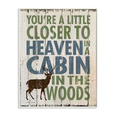 a wooden sign that says you're a little closer to heaven in the woods