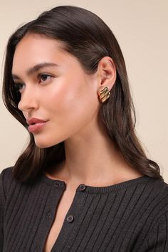 Create a look that is bound for compliments with accessories like the Lulus Exceptional Delight Gold Statement Earrings! These uniquely chic stud earrings are composed of shiny gold-toned metal that shapes a bold, geometric-inspired shape with a ripple-like effect throughout, lending an extra bold finish. Post Backs. 1. 5" Long And 1. 5" In Diameter. 100% Alloy. Imported. Lulus | Exceptional Delight Gold Statement Earrings. Statement Stud Earrings, Geometric Inspiration, Gold Statement Earrings, Gold Tone Metal, Statement Earrings, Gold Tones, Stud Earrings, Gold