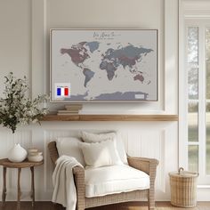 a living room with a chair and a map on the wall