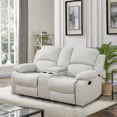 a living room scene with focus on the reclining sofa