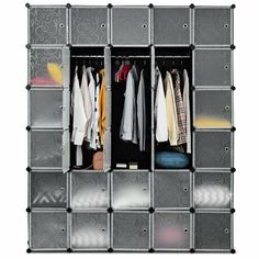 an organized closet with clothes hanging on the racks and drawers in grey plastic bins