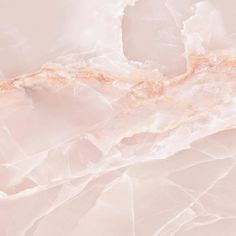 an abstract pink marble background with gold accents