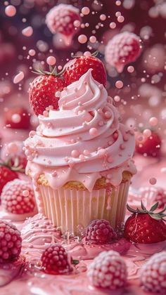 a cupcake with white frosting and strawberries on the top is surrounded by pink sprinkles