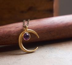 "A bewitching half moon necklace with a delicate, natural amethyst accent Your new favorite, everyday necklace or the perfect gift for someone special, boxed and ready to give. ⟴ Amethyst is the birthstone of February and is associated with the zodiac sign of Aquarius Looking for more moon stone options? ☽ Black onyx: https://www.etsy.com/ca/listing/807368977/witch-moon-necklace-boho-necklace ☽ Moonstone: https://www.etsy.com/ca/listing/693346509/moonstone-necklace-boho-necklace ☽ Turquoise: htt Oddities Jewelry, Witch Moon, Half Moon Necklace, Witch Jewelry, Necklace Turquoise, Celestial Jewelry, Everyday Necklace, Peach Moonstone, Moonstone Necklace