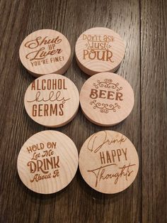 four wooden coasters with different types of alcohol on them, and the words drink me happy