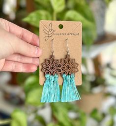 Get your free-spirit boho vibe on with these fun handmade macrame flower earrings!  These bohemian earrings were carefully hand knotted using soft recycled cotton cord on a wood flower piece. These dangle earrings are very lightweight. Makes the perfect gift for the hippie girl in your life.  Handmade with love in the USA.  *Nickel free earrings. Handmade with eco-friendly materials! I use high quality cord made from recycled cotton. Nearly all my products are made with recycled cotton or recycled polypropylene cord. I strive to be as eco-friendly as possible with all my materials and processes. ** Attention local buyers ** If you prefer to arrange for in-person pick up instead of having your item shipped to you, please message me after placing your order and I can refund any shipping cost Bohemian Adjustable Macrame Tassel Earrings, Turquoise Bohemian Flower Earrings For Gift, Turquoise Handmade Tassel Earrings For Festivals, Handmade Turquoise Tassel Earrings For Festival, Bohemian Macrame Jewelry For Crafting, Spring Bohemian Turquoise Jewelry, Bohemian Macrame Tassel Dangle Earrings, Bohemian Macrame Tassel Earrings, Bohemian Tassel Earrings With Fringe For Spring