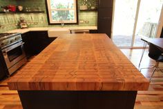 a large wooden counter top in a kitchen