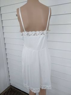 "Vintage White Slip by Penneys Gaymode - Hand washable 100% nylon Size 34, check measurements: Measures 16.5\" across bust laid flat. So 33\" around bust - there is more room in the cups. Measures 14.5\" across under bust. So 29\" around. 30\" waist. 35\" hips. 33\" long. Adjustable strap. Mannequin is 5'8\" XS 32/35/34 Good condition with a couple tiny spots. Regarding customs: You are responsible for all customs fees and charges. Please note: We will not falsify customs documents, so please do Vintage White Lace Dress, Hippie Shirt, Dress Slip, White Lace Dress, Lace Slip Dress, White Slip, Lace Slip, Lace White Dress, Retro Outfits