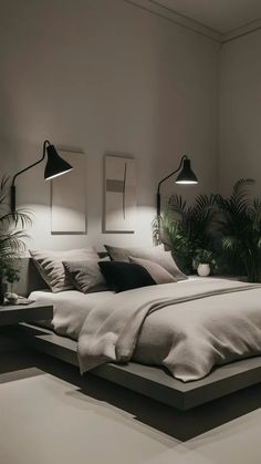 a large bed sitting in a bedroom next to two lamps on either side of it