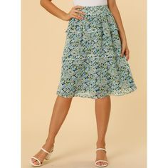 Inspired by romantic style, this skirt will lend some feminine style to your look. Made from lightweight chiffon, the tiered ruffle hem, midi length, and floral printed pattern overall, it completes a vintage silhouette. This sweet floral skirt is designed with a floaty tiered ruffle hem and a smocked waist. Pair it with flats or heels for a pretty and sweet style. The model is wearing an X-Small. Flared Ruffle Skirt For Garden Party, Flared Ruffled Skirt For Garden Party, Ruffled Flared Skirt For Garden Party, Tiered Skirt With Elastic Waistband For Garden Party, Knee-length Ruffled Skirt For Day Out, Flowy Ruffle Hem Skirt For Garden Party, Flowy Skirt With Ruffle Hem For Garden Party, Tiered Flowy Skirt For Garden Party, Tiered Skirt With Ruffles For Garden Party