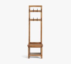 a tall wooden shelf with hooks on it