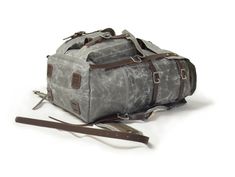 The Freefolk Bushcraft Backpack in Grey and stainless steel hardware. This bag has been handcrafted for adventures or peaceful time in the woods. You can easily fit IN and ON the bag all your gear and supplies needed for weeks in the wilderness. Made of genuine leather, solid brass or stainless steel hardware and quality waxed canvas Freefolk won't let you down. We are waxing canvas ourselves, blending four ingredients to meet the best resistance possible. Beeswax included in the blend comes fro Practical Standard Backpack For Camping, Rugged Rectangular Backpack For Outdoor, Rectangular Waxed Leather Backpack For Outdoor, Rugged Outdoor Rectangular Backpack, Practical Rectangular Hiking Backpack, Rectangular Leather Backpack With Waxed Finish For Outdoor, Handmade Outdoor Standard Backpack, Handmade Outdoor Backpack, Rectangular Waxed Canvas Outdoor Backpack